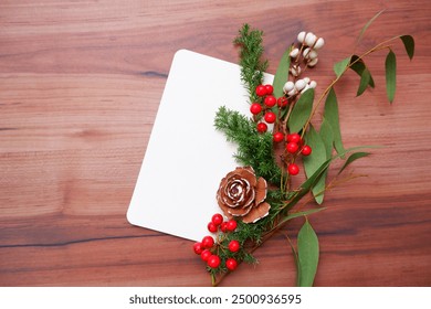 Winter green and red Berries decoration with blank card. Holiday and Christmas natural elements decorative background. - Powered by Shutterstock