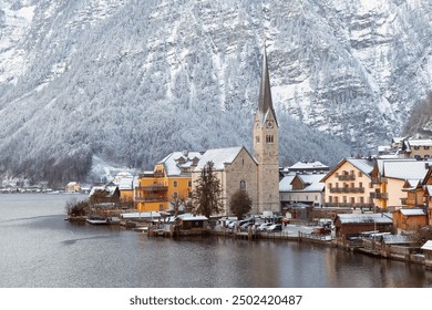 Winter Hallstatt village with snowy mountains and traditional houses, Austria - Powered by Shutterstock