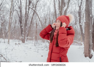 Winter Happy Asian Woman Looking Up Having Fun In Outdoor Nature Park. Beauty Dry Skin Care Face Concept, How To Protect From The Cold.