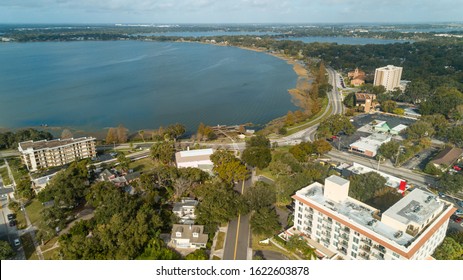 "Winter Haven, FL / USA - 1/12/2020: Aerial drone shot of downtown Winter Haven, FL on a sunny day."