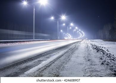 Winter Highway At Night Shined With Lamps