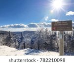 Winter hiking the Summit trail at Mount Sunapee, New Hampshire for some stunning views.