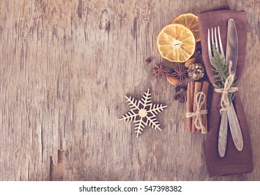 Winter Holiday Dinner Plate Decoration On Old Wood Background. Table Set With A Winter, Christmas Decoration. Winter Holiday Theme.  Happy New Year. Space For Text. 