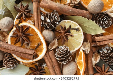 Winter holiday potpourri - mix of dried oranges, cinnamon stick, nutmeg, star anise, cloves, pine cones, bay leaves for a festive blend of scents - Powered by Shutterstock