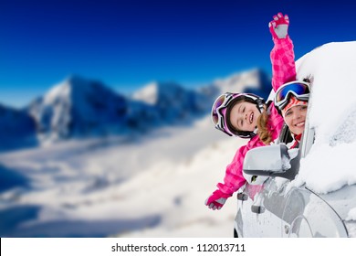 Winter holiday, ski, travel - happy family on the road for winter holidays