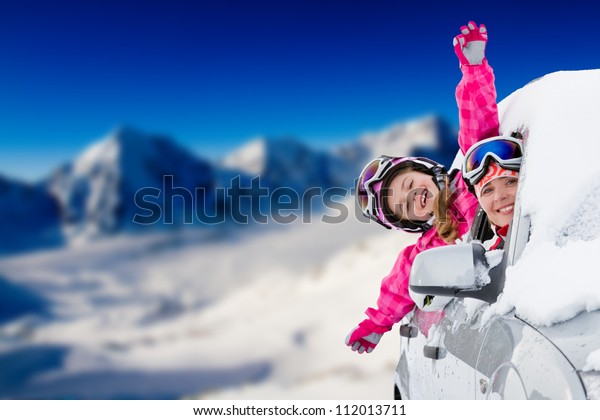 Winter holiday, ski, travel - happy family on\
the road for winter\
holidays