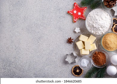 Winter Holidays Baking Background, Flour, Bakeware,sugar, Butter, Cookie Cutter,eggs,cinnamon And Cookies On Grey Stone Kitchen Table, View From Above With Copy Space For Text