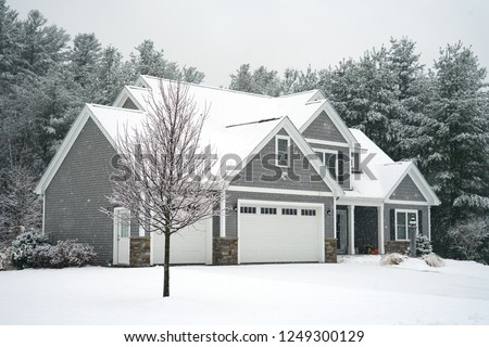Winter house with woods in snow storm           