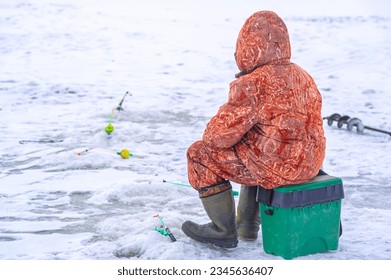 Winter ice fishing. Ice fishing is a great way to pass the time during the winter months and gives anglers the chance to catch some truly trophy fish. - Powered by Shutterstock