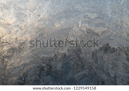 Winter ice pattern on window glass