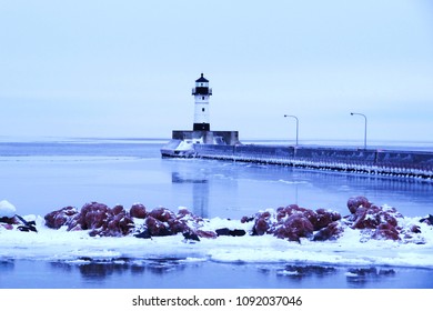 Winter Image Of Duluth Minnesota Lighthouse Canal Park Harbor Near Bridge Wintertime Photo With Snow And Ice Historic 