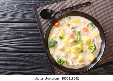 Winter Japanese Cream Stew is a mix of meat and vegetables cooked in a thick white roux close-up in a bowl on the table. Horizontal top view from above