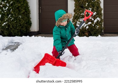 Winter Kids Fun Outdoor Sports. Girl Clearing Sidewalks And Shoveling Snow. Child Removaling Snow With  Shovel. Little Helper For Parents. 