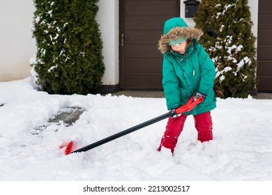 Winter Kids Fun Outdoor Sports. Girl Clearing Sidewalks And Shoveling Snow. Child Removaling Snow With  Shovel. Little Helper For Parents. 