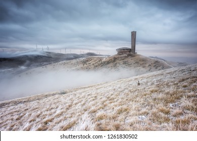 Winter landscape with abandoned Buzludzha monument and the frosty foggy peaks of Balkan Mountains, Bulgaria