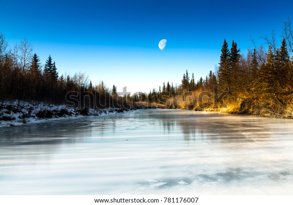Winter landscape. Big Moon landscape. first\
light. Early morning.  WInter\
wonderland