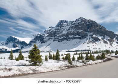 Winter Landscape. Canadian Rocky Mountains, Fir Trees, And Frozen Bow Lake Covered By Snow. Banff National Park, Alberta, Canada.