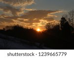 Winter landscape with 
Clouds and sunset