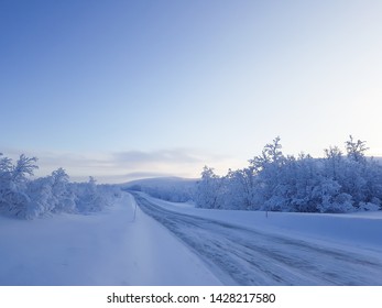 Winter Landscape At Desolate Road In Lapland, Finland. 