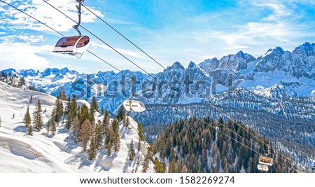 Winter landscape in Dolomites at Cortina D'Ampezzo ski resort, Italy, Monte Castello area, chair lift installation