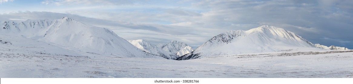 Winter Landscape. Dramatic Overcast Sky.Severe Mountains Peaks Covered By Snow. Russia, Siberia, Altai Mountains, Chuya Ridge.