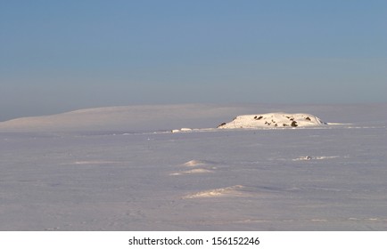 winter landscape of fields and trees covered with snow
