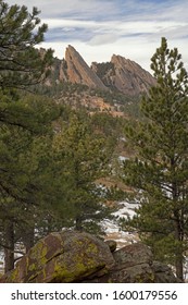 Winter landscape of the Flatirons framed by conifers, Rocky Mountains, Boulder, Colorado, USA 