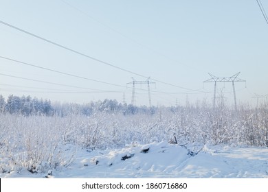 Winter Landscape With Frozen Trees And A High-voltage Power Line In The Golden Hour.