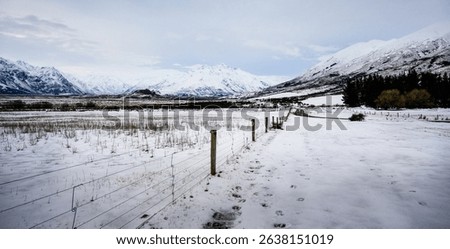 Winter landscape of mountain and farmland in Ashburton Lakes. Canterbury. South Island. 