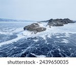 Winter landscape with mountains and Lake Baikal in Siberia. Natural background. Great backdrop for your design with copy space. Aerial view.