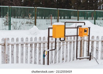 Winter Landscape With Natural Gas Pipeline And Yellow Meter Box