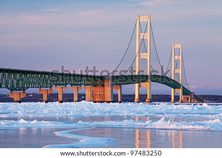 Winter landscape near sunset of the Mackinac Bridge and the frozen Straits of Mackinac, Michigan's Upper and Lower Peninsulas, USA