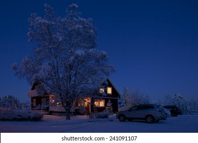 Winter Landscape In The Night. Farm Buildings After Sunset Up North On Christmas Eve. 