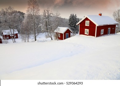 Winter Landscape With Old Rural Cottages In Sweden