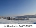 Winter landscape overlooking a frozen lake