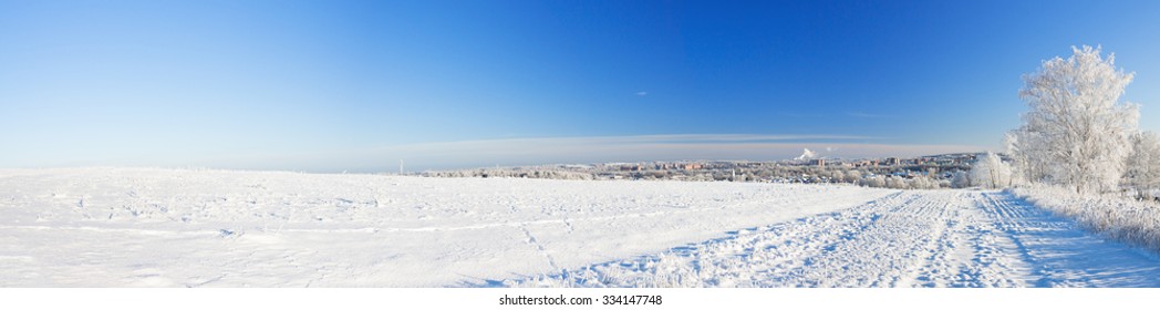 Winter Landscape, Panorama With A Field And The City