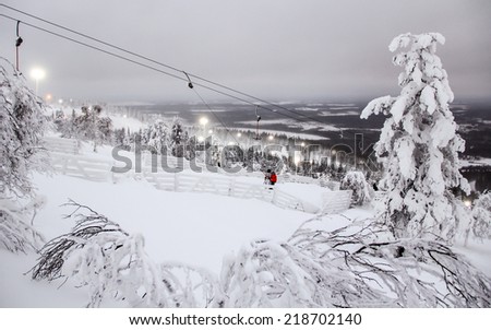Winter landscape with ski lift in Levi resort in Lapland, Finland, at polar night