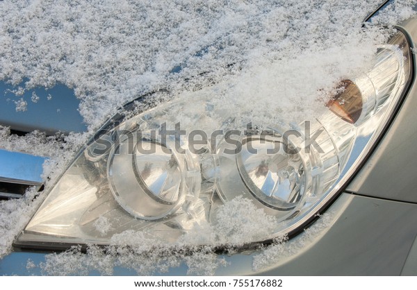 Winter landscape. snow covered car. Sunny day,\
heavy frost.