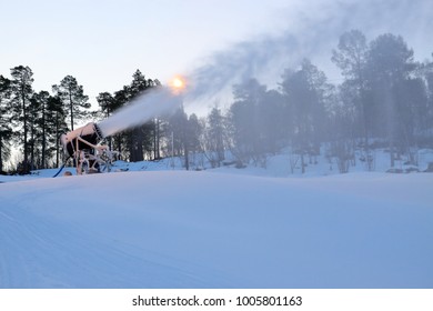 Winter Landscape With Snow Making Machine Blowing Fake Snow