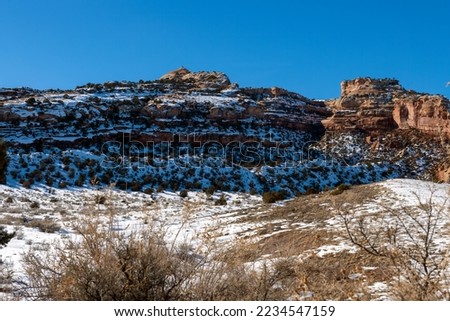 Winter landscape from South Camp Road in Grand Junction. Colorado with red sandstone cliffs of the Colorado National Monument.