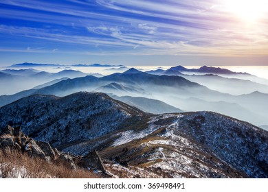 Winter Landscape With Sunset And Foggy In Deogyusan Mountains, South Korea.