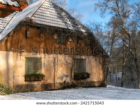 winter landscape, view of an old house, wooden windows, winter