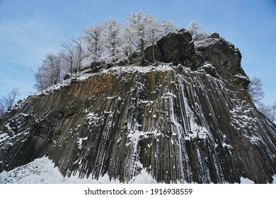 winter in the Lusatian mountains in the north of the Czech Republic. Basalt rock Zlaty vrch. - Shutterstock ID 1916938559