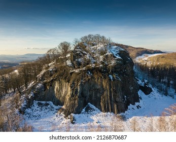 Winter in the Lusatian mountains in the north of the Czech Republic. Basalt rock Zlaty vrch. Volcano rock formation Zlaty vrch built pentagonal and hexagonal basalt columns.  - Shutterstock ID 2126870687