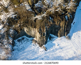 Winter in the Lusatian mountains in the north of the Czech Republic. Basalt rock Zlaty vrch. Volcano rock formation Zlaty vrch built pentagonal and hexagonal basalt columns.  - Shutterstock ID 2126870690