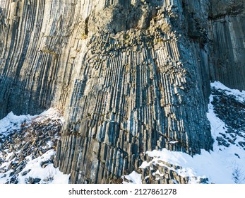 Winter in the Lusatian mountains in the north of the Czech Republic. Basalt rock Zlaty vrch. Volcano rock formation Zlaty vrch built pentagonal and hexagonal basalt columns.  - Shutterstock ID 2127861278