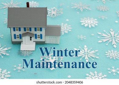 Winter Maintenance Message With Model House With Blue And Silver Snowflakes