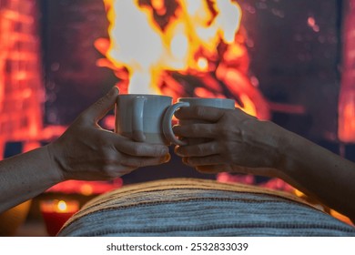 Winter Moments. Couple Enjoying Hot Drinks Indoors by the Fireplace.Cozy And Serene Moments Perfect For Indoor Relaxation, Bonding, And Shared Comfort in Family - Powered by Shutterstock