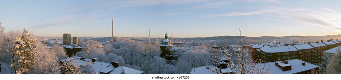 Winter morning colourful beautiful panorama sunrise with snow and buildings Liseberg tower downtown GÃ¶teborg Sweden