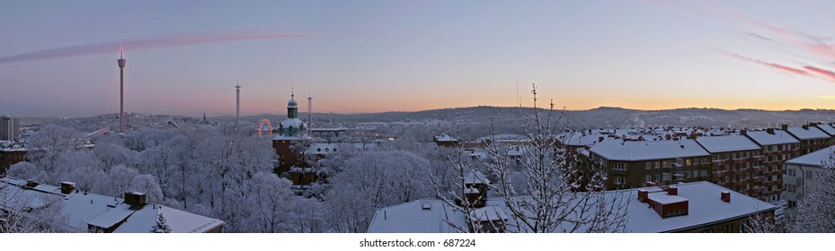 Winter morning dawn colourful beautiful panorama sunrise with snow buildings and clouds GÃ¶teborg Sweden